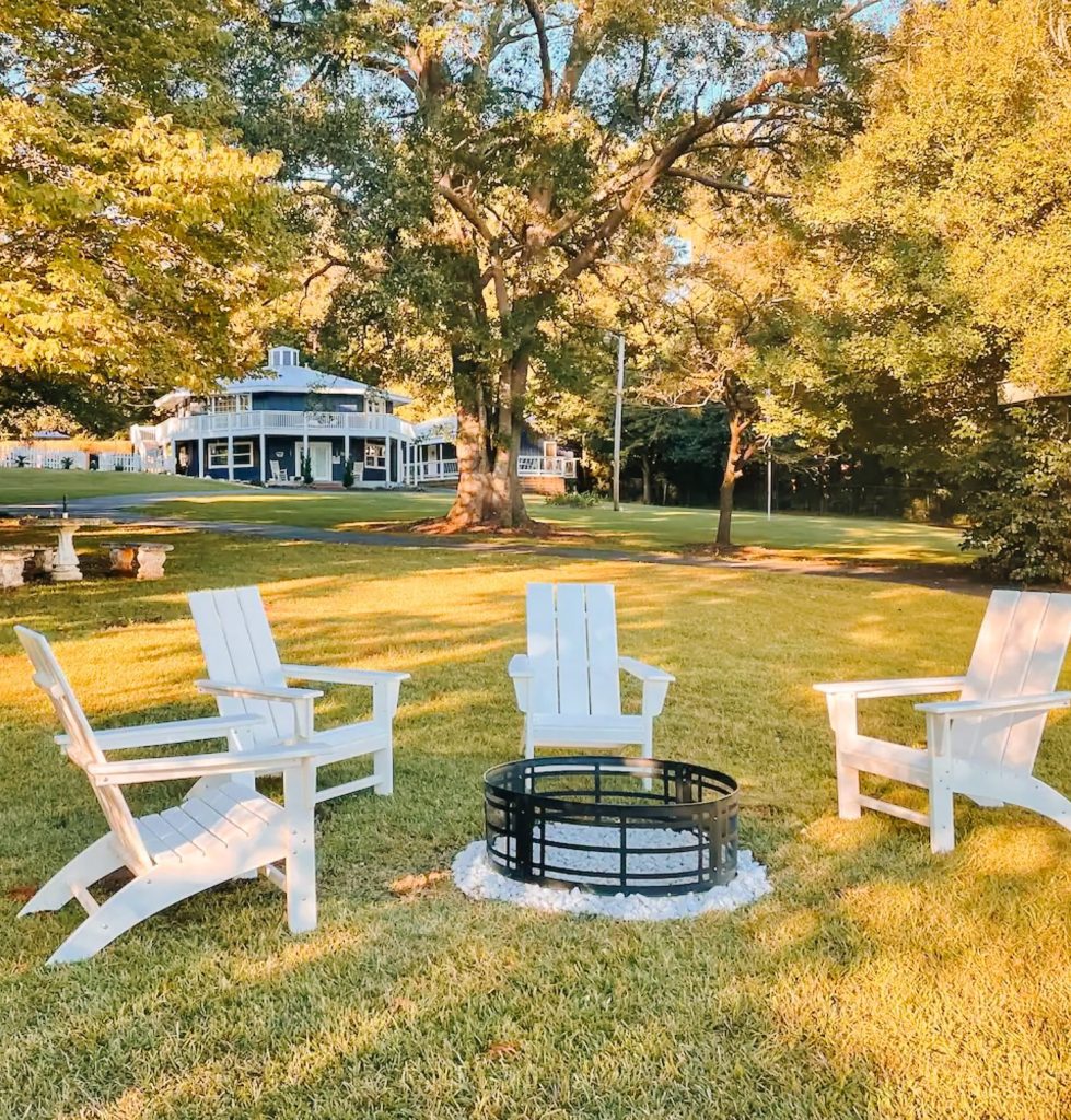 An outdoor firepit with chairs at a rental house in Lake Sinclair.